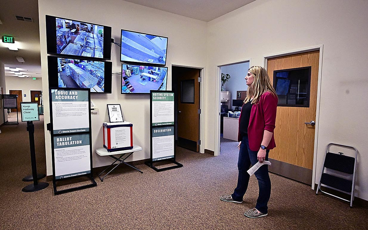 Joanna Francescut, Assistant Registrar of Voters, views screens offering a glimpse from security cameras at the Shasta County Clerk & Registrar of Voters office in 2024 in Redding in Northern Califonia's Shasta County.
