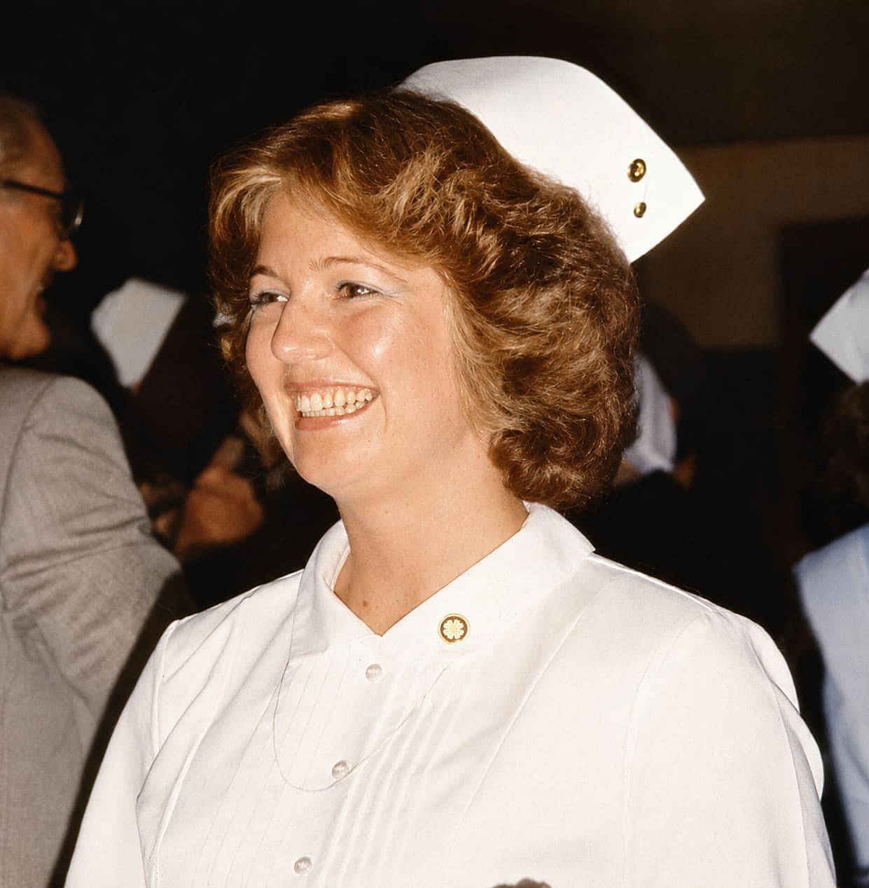 Woman smiling since she finished nursing school, in 1980.