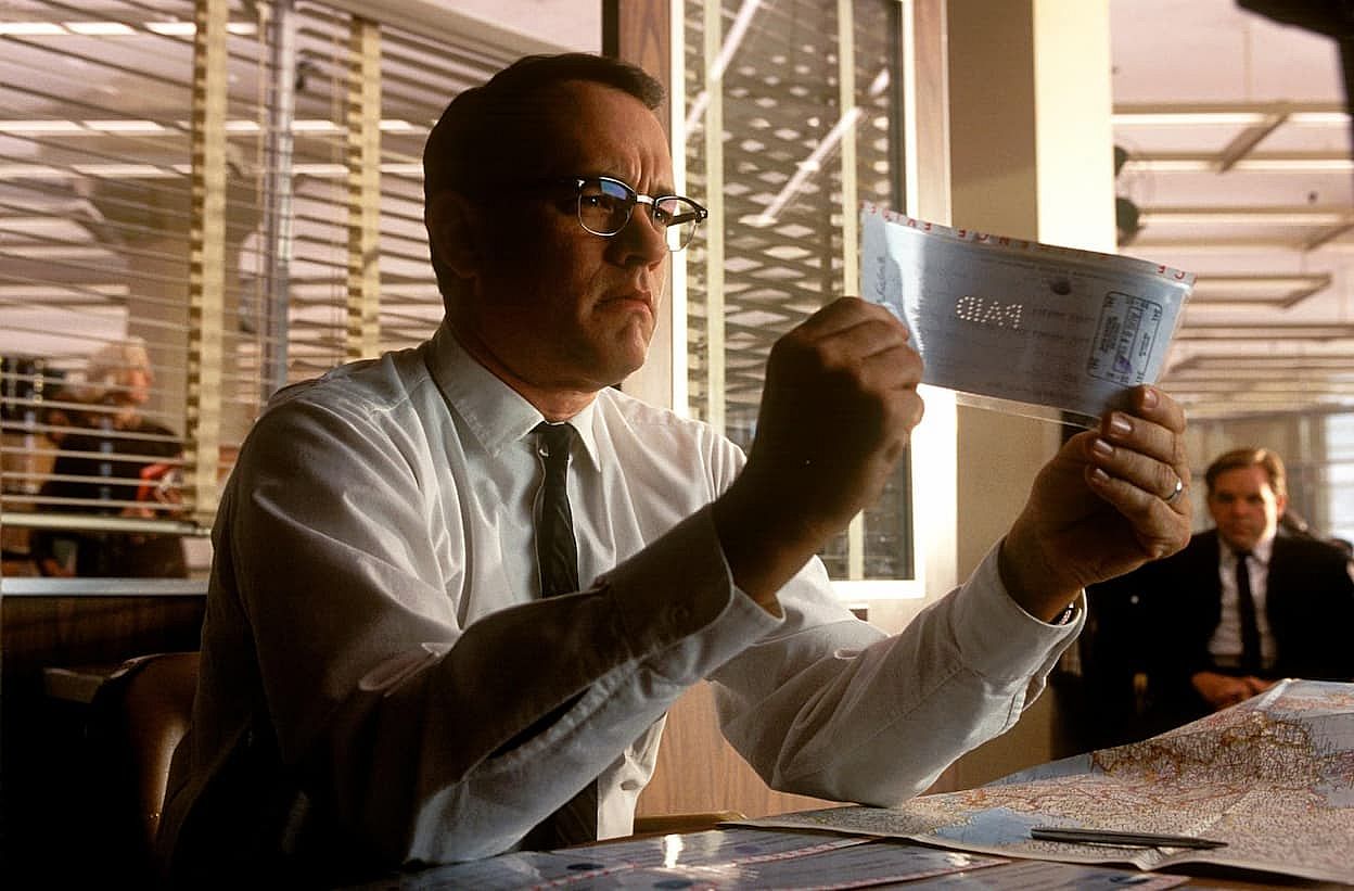Tom Hanks holding a fake plane ticket in Catch Me If You Can