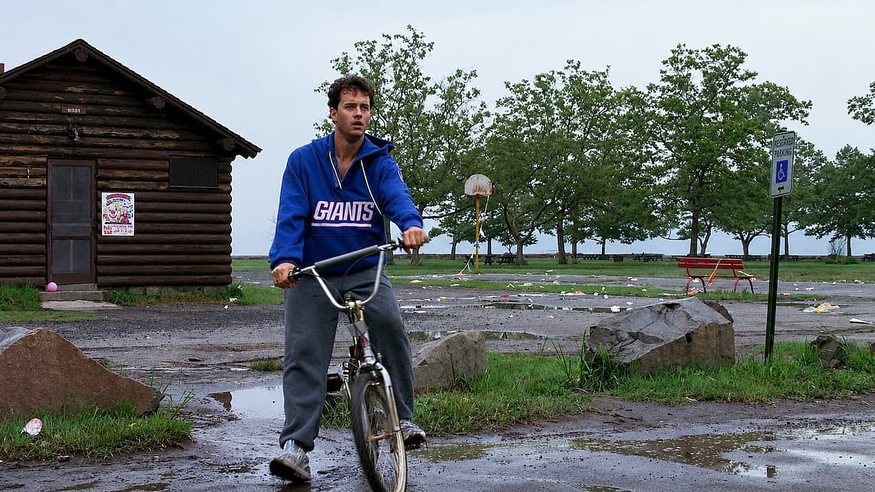 Tom Hanks riding a bike for a scene of Big.