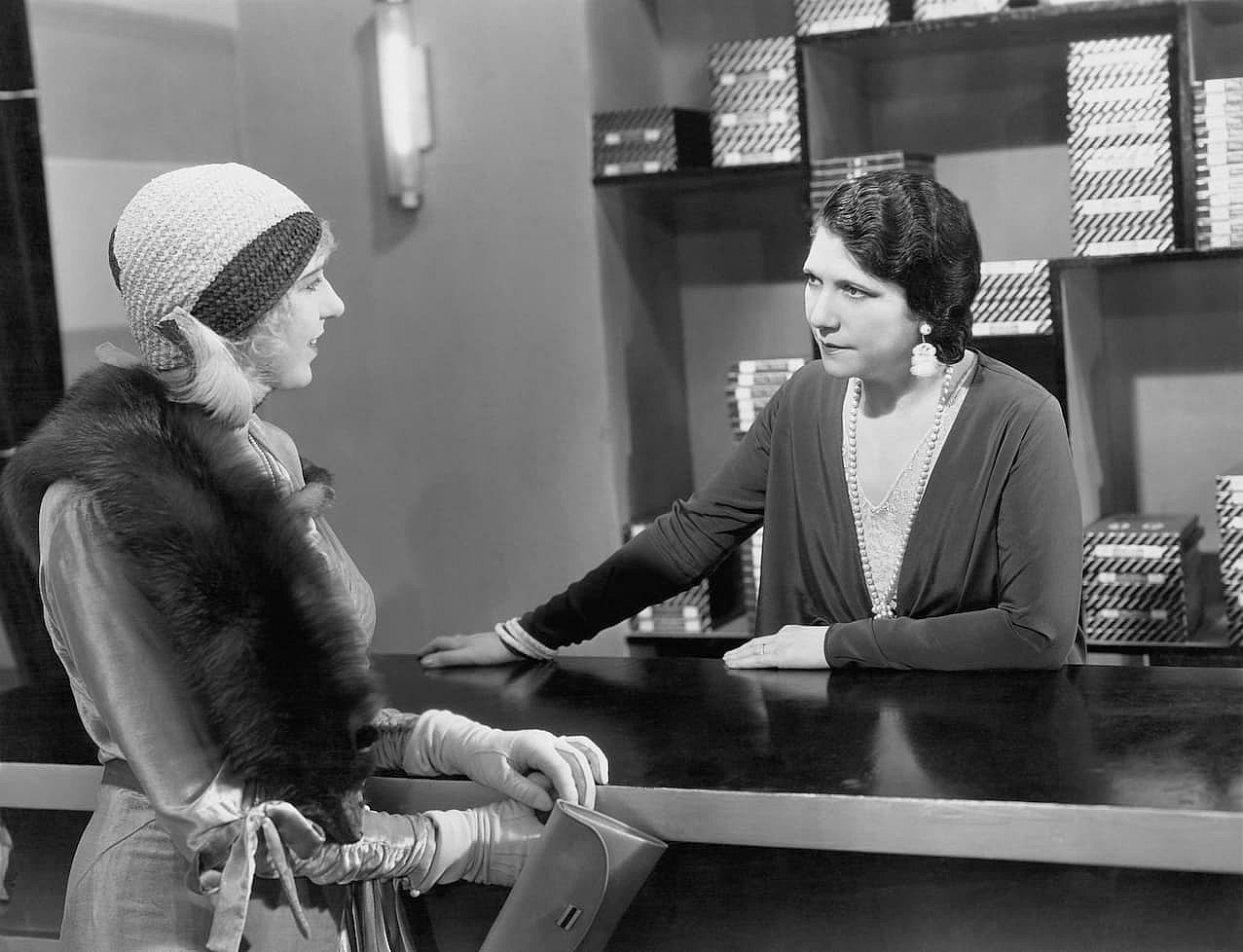 Vintage photo of two women talking.