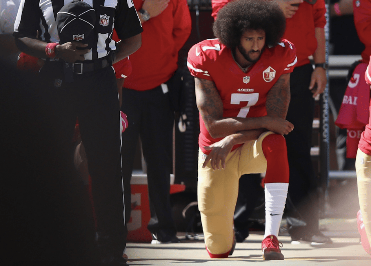 2016: THIS TIME, KAEPERNICK TAKES A STAND BY KNEELING