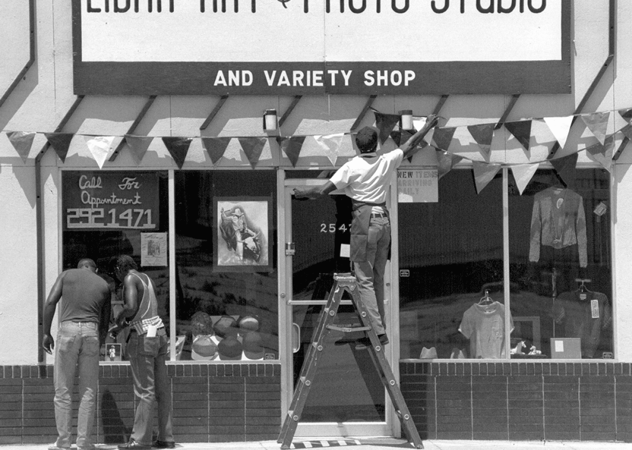 Photographer decorates storefront for Juneteenth celebrations.