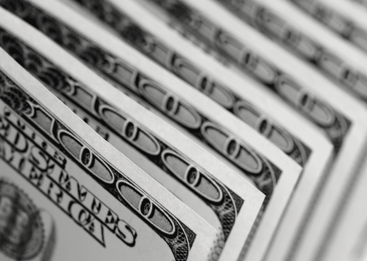 Hundred dollar bills in a row.