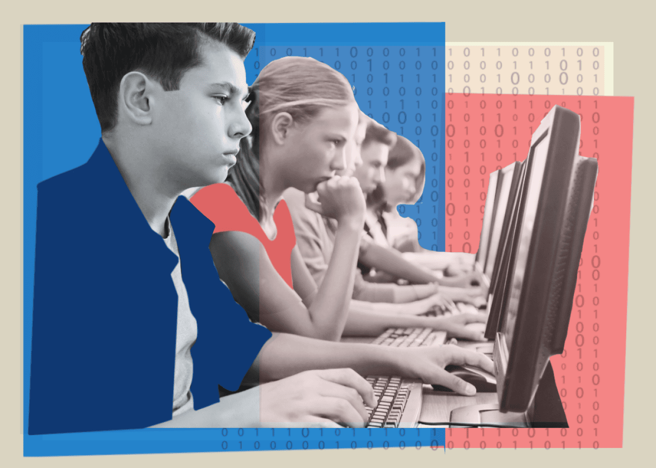 Students working at computers in a classroom on computers.