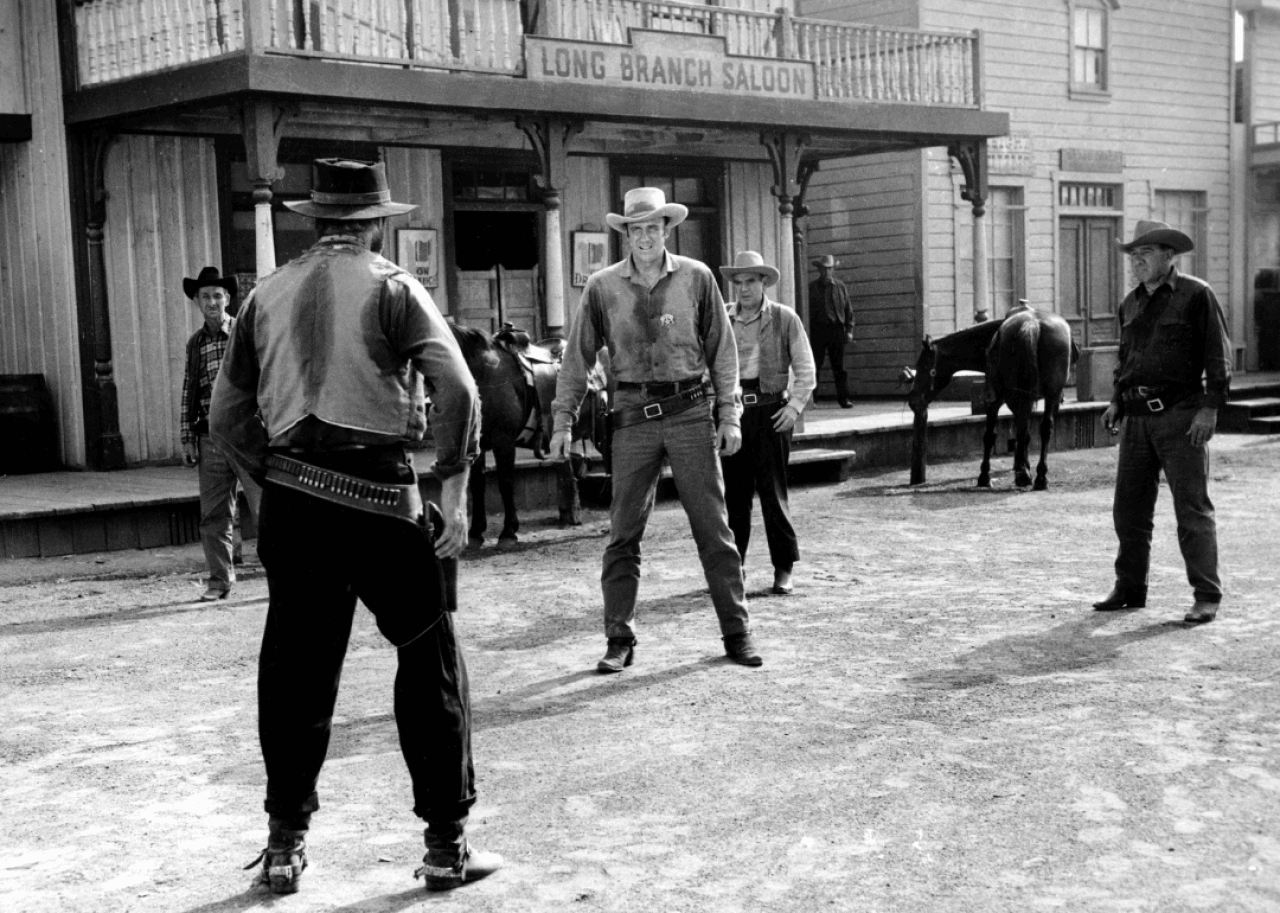 Cowboys having a duel in the street.