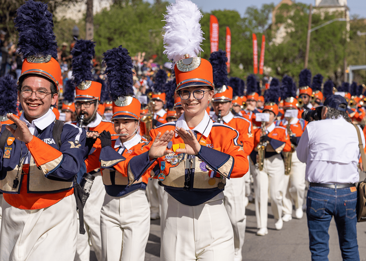 The University of Texas at San Antonio Marching Band performing at parade.