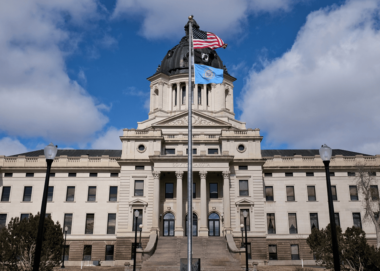South Dakota Statehouse and flag.