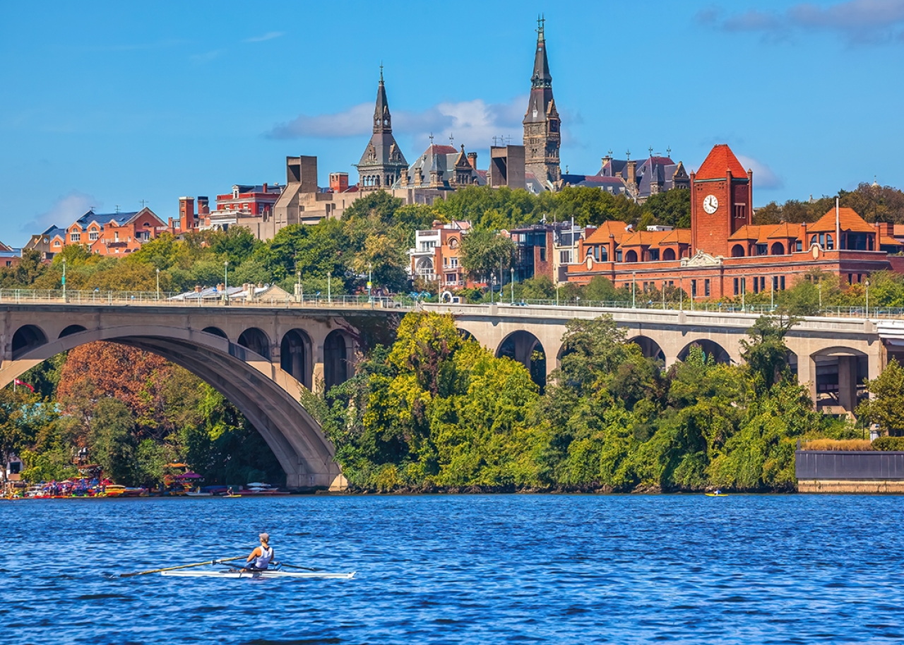 Person rowing on the Potomac River by Key Bridge.