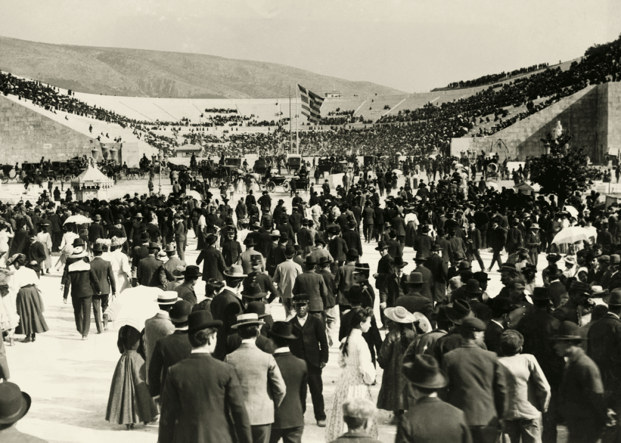 A crowd of 80,000 fills the Panathenaic Stadium