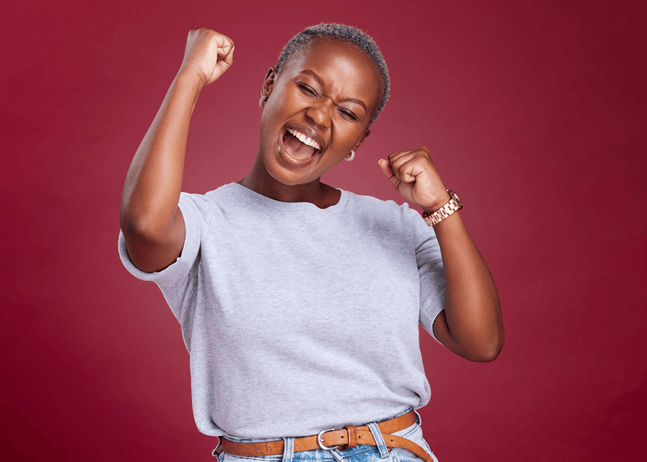 Excited woman celebrating success.