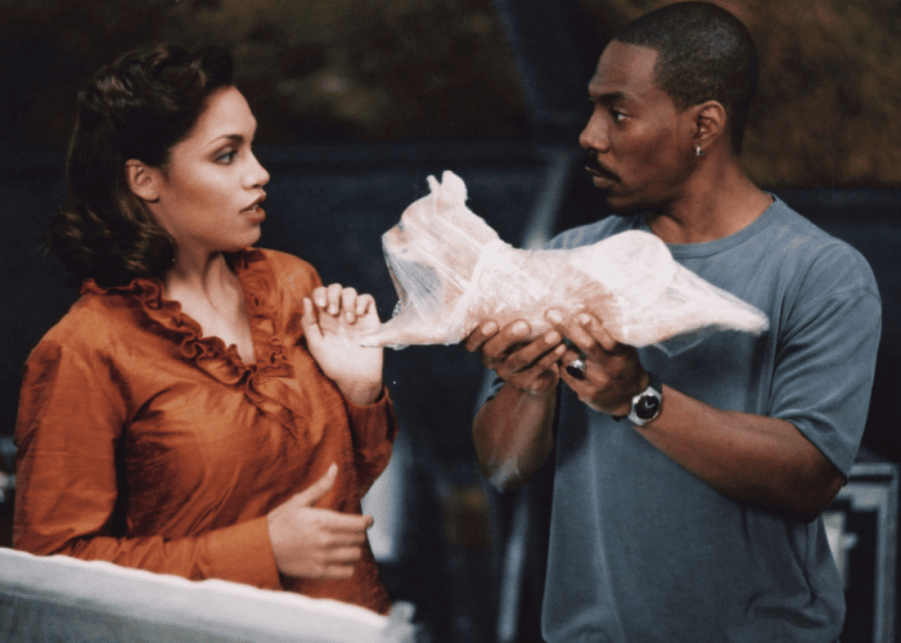 Eddie Murphy and Rosario Dawson in ‘The Adventures of Pluto Nash’.