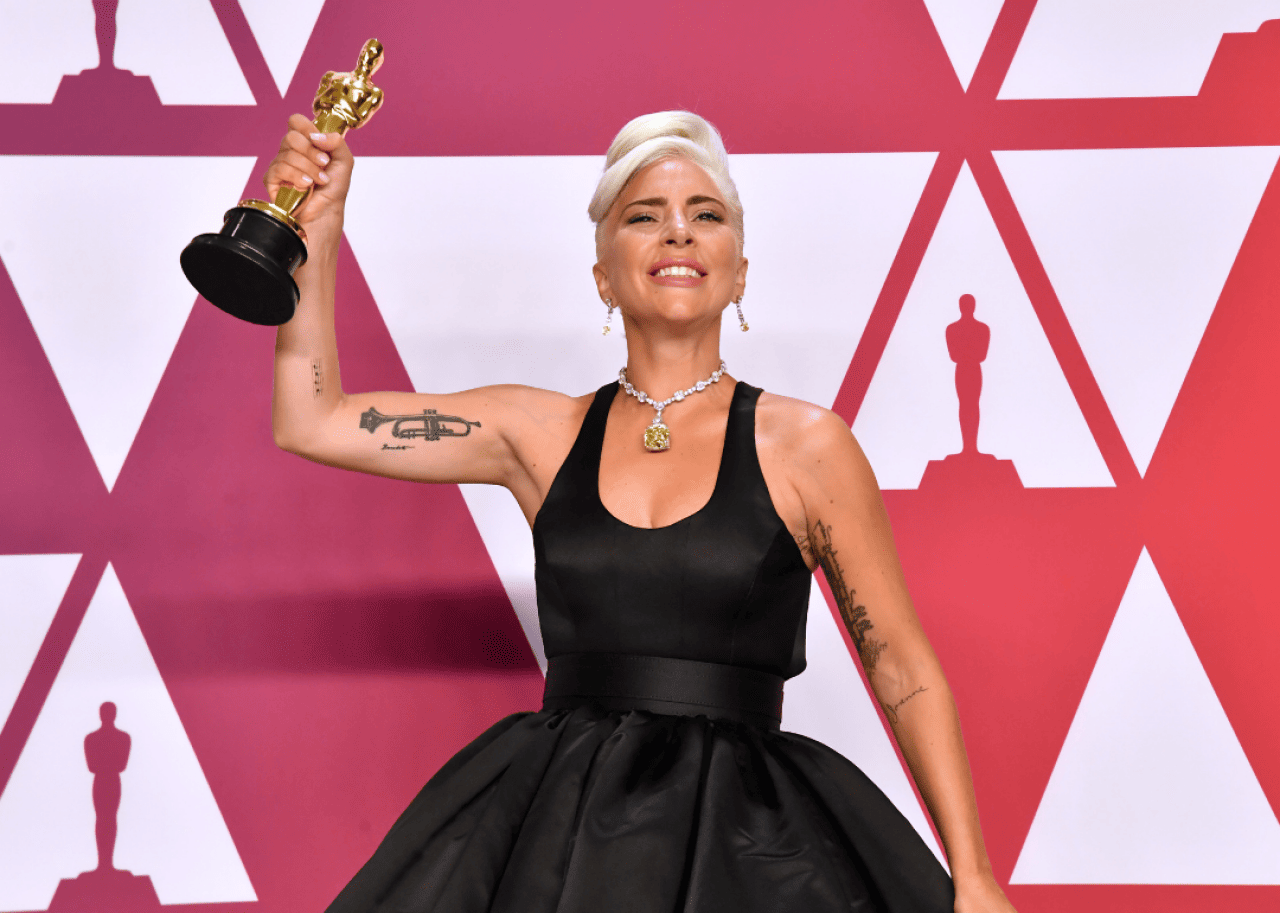 Lady Gaga: First woman to win an Oscar, Grammy, BAFTA, and Golden Globe in the same year Lady Gaga poses with Academy Award.