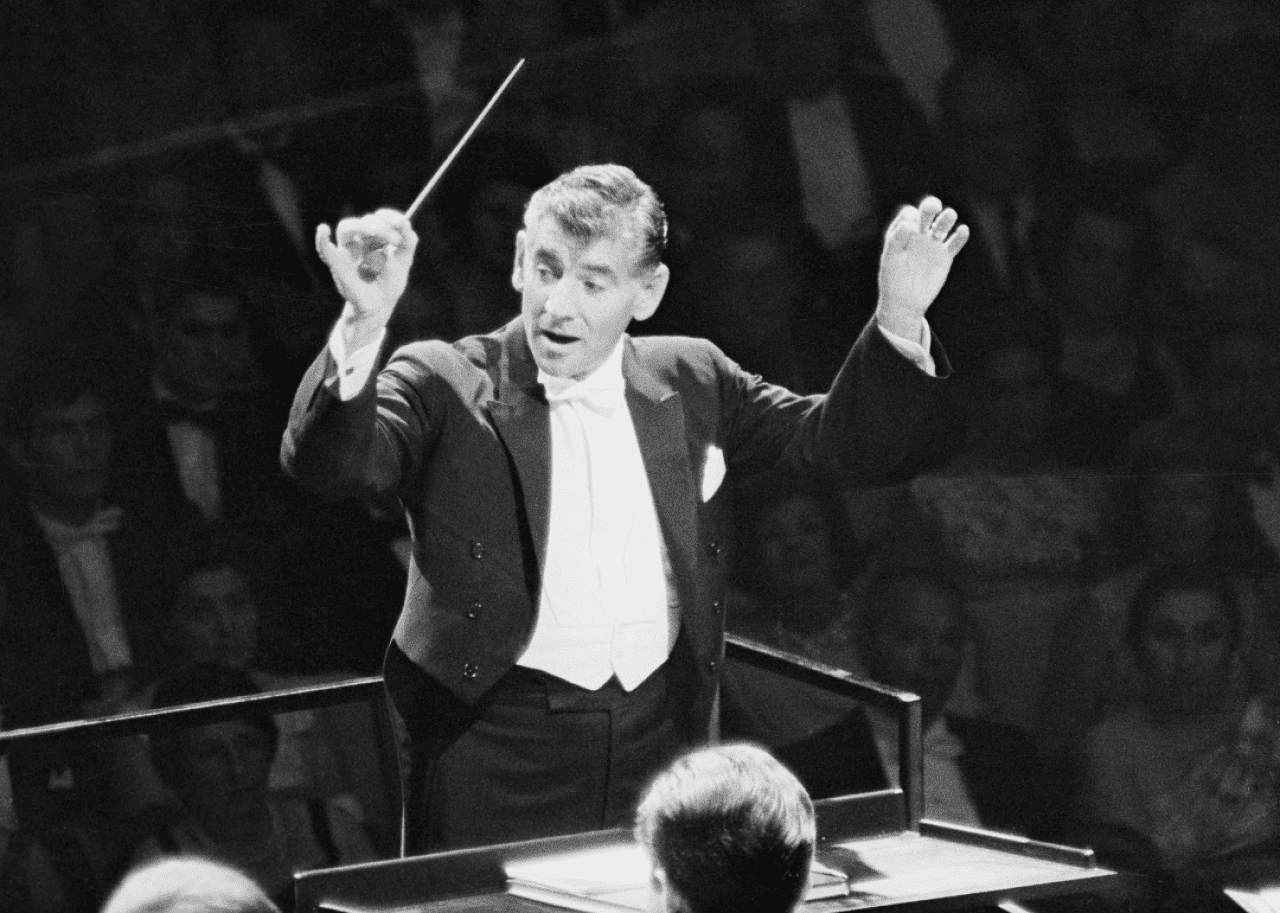 Leonard Bernstein: The first American to lead a major American orchestra Leonard Bernstein conducts the New York Philharmonic.