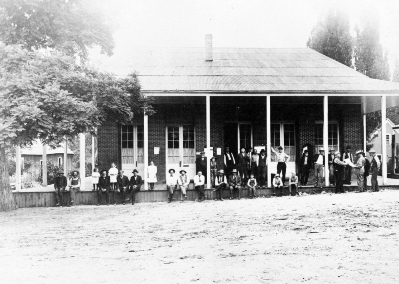 Group of mill workers seated for portrait
