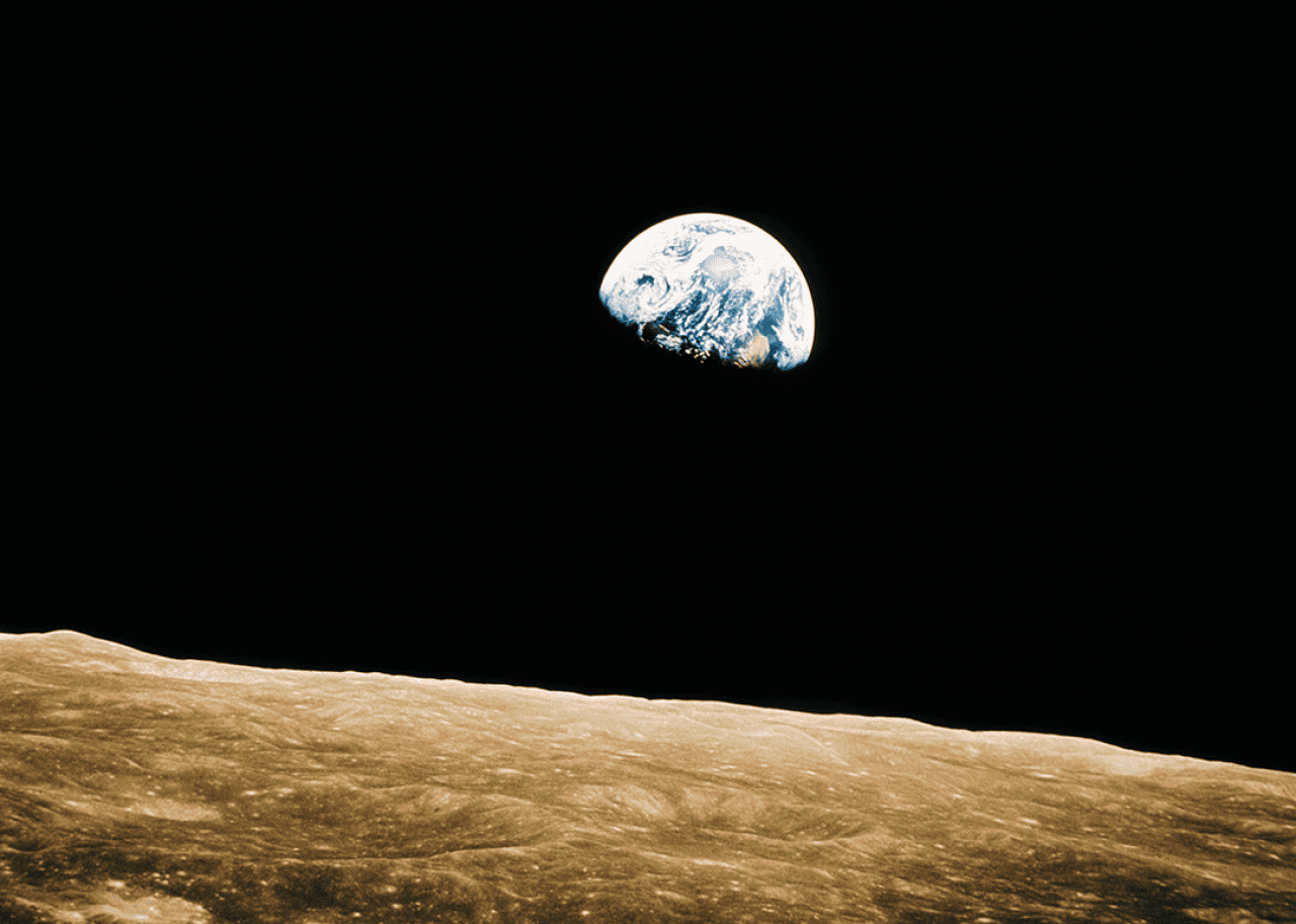 Earth above moon’s surface.