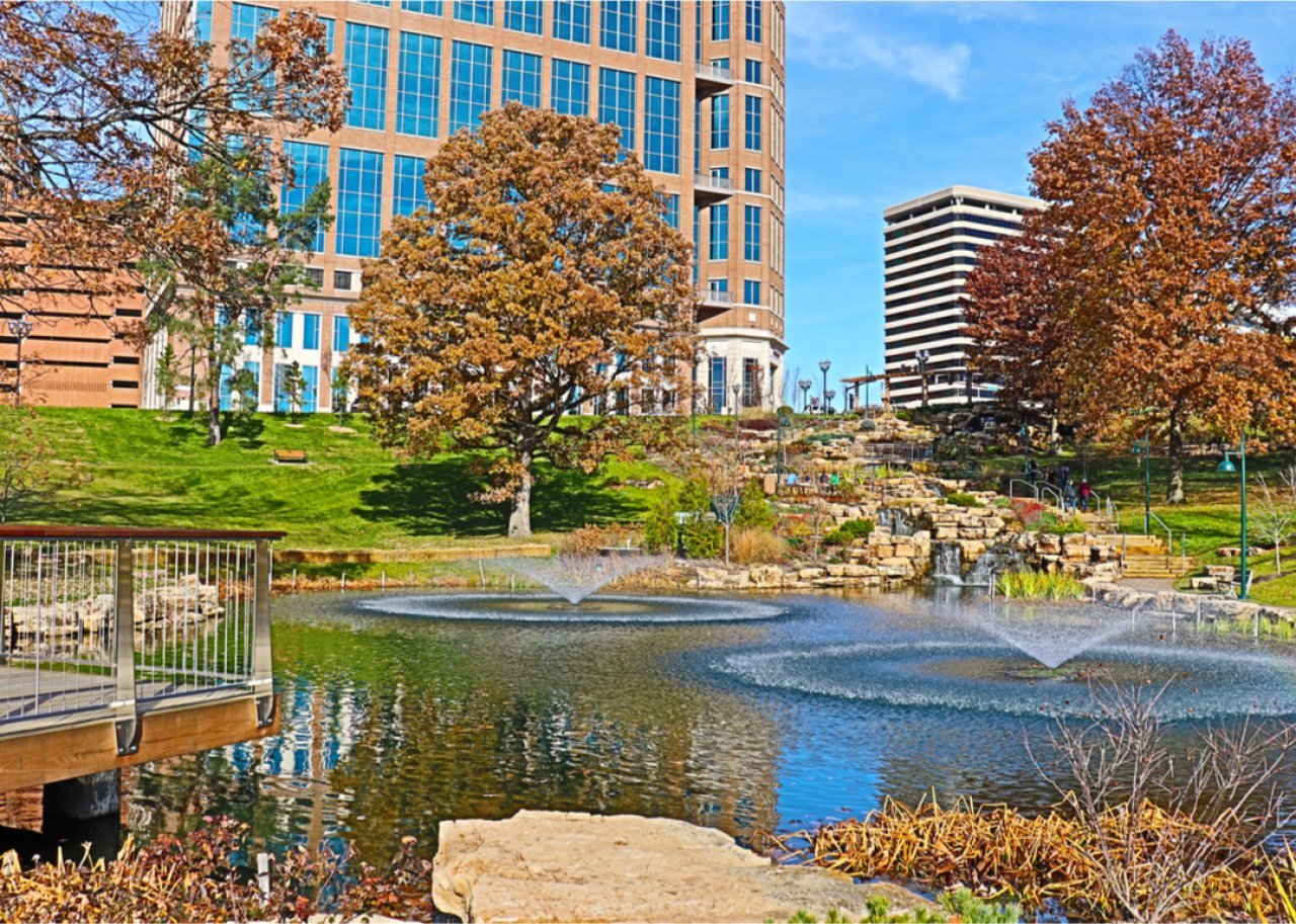 Fountain in park and buildings in Clayton.