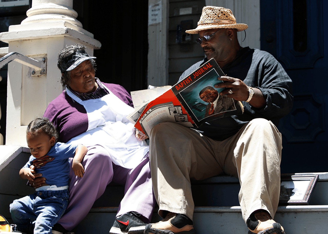 Community members share stories at a park in Oakland.