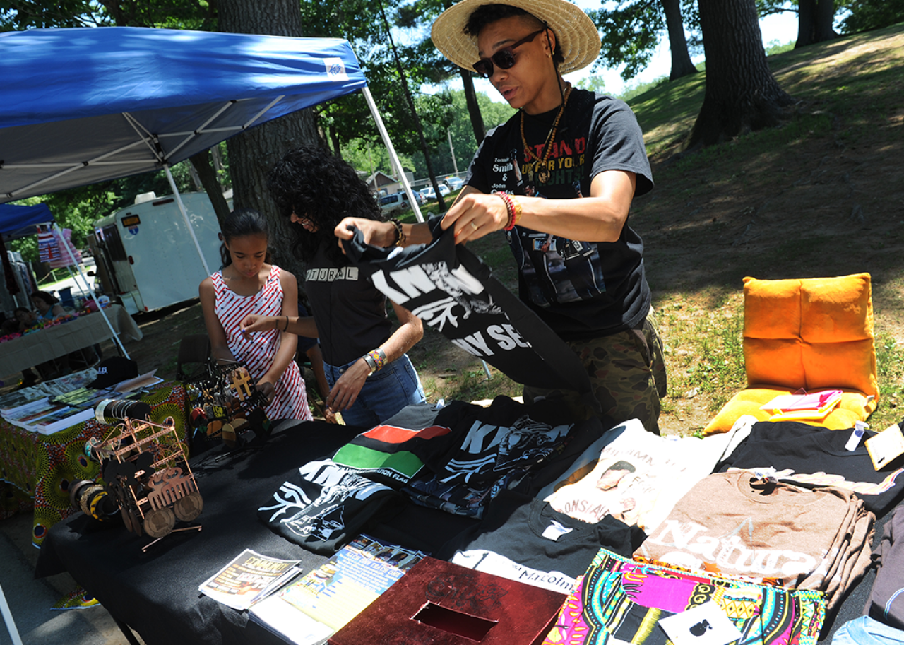 A woman fundraises for a community center at a Juneteenth celebration in Schenectady.