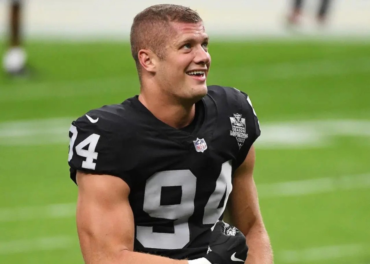 Carl Nassib of the Las Vegas Raiders smiling during warmups before a game against the Denver Broncos at Allegiant Stadium on Nov. 15, 2020 in Las Vegas, Nevada.