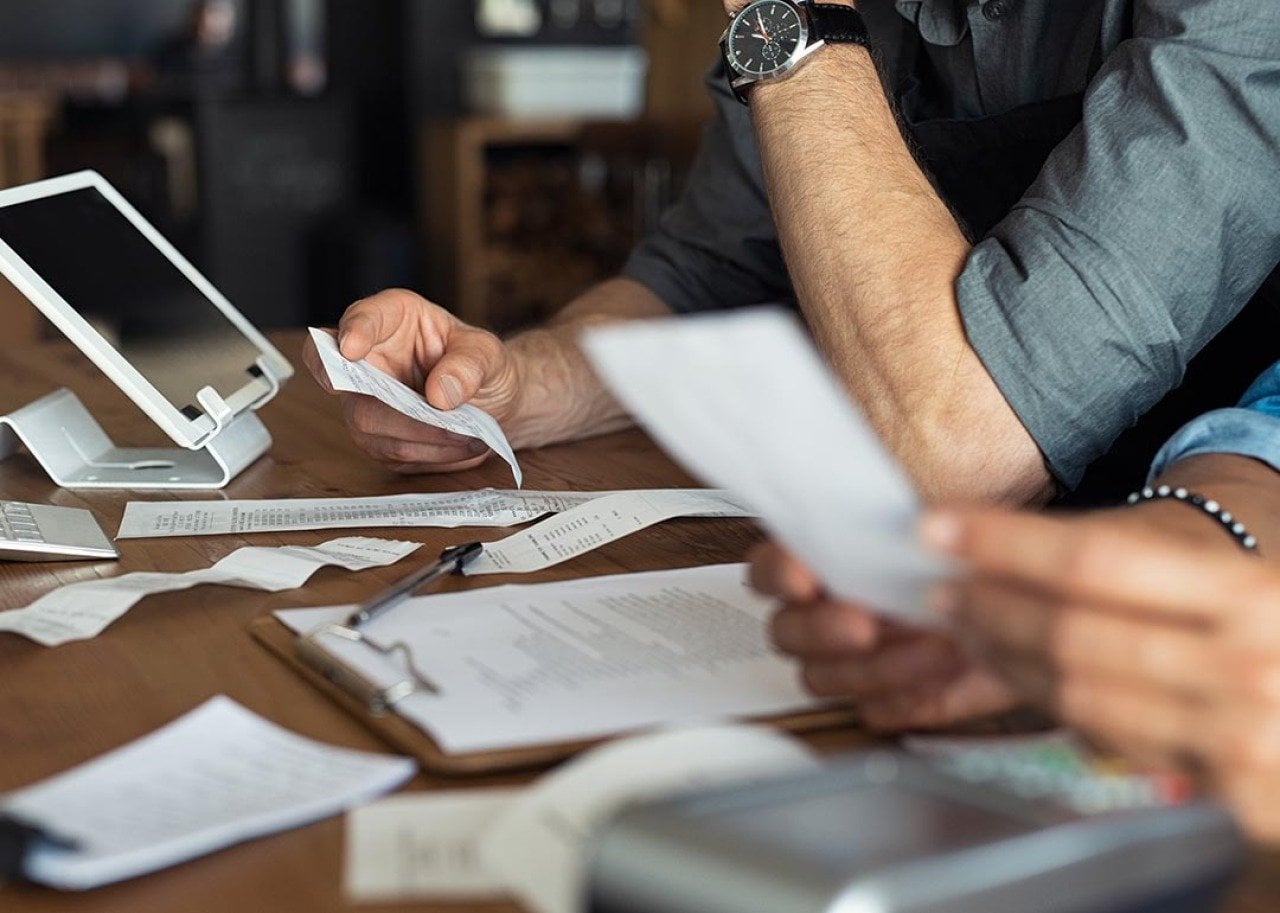 business owners going through receipts and finances