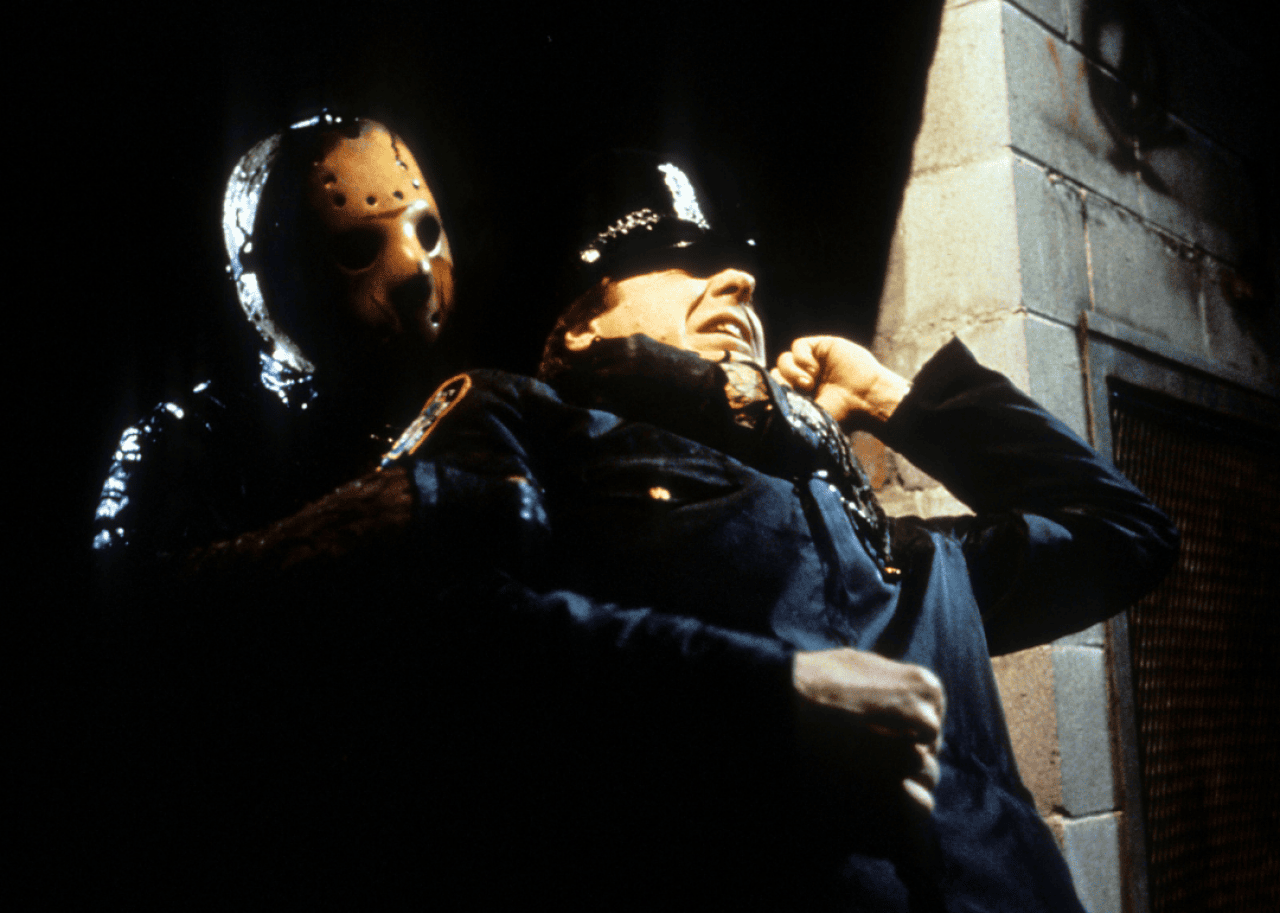 Jason grabs cop in a scene from the film 'Friday The 13th Part VIII: Jason Takes Manhattan', 1989.