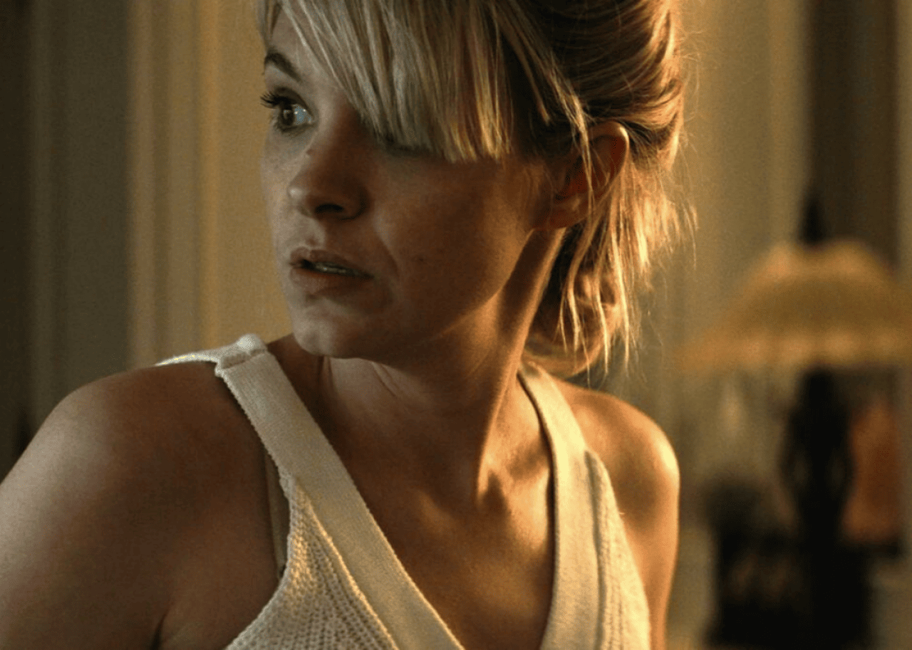 Woman looking behind her with caution