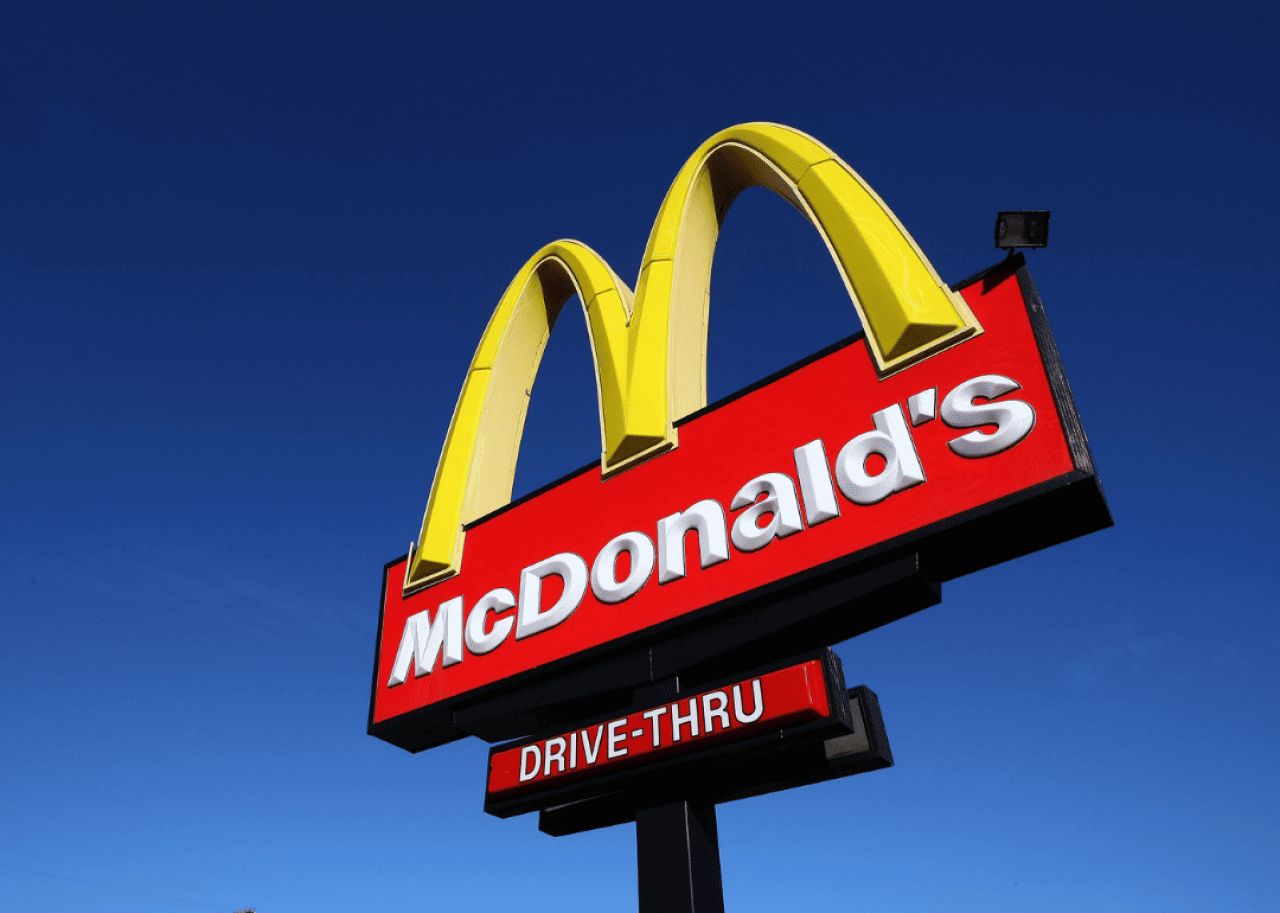 A sign stands outside of a McDonald's restaurant