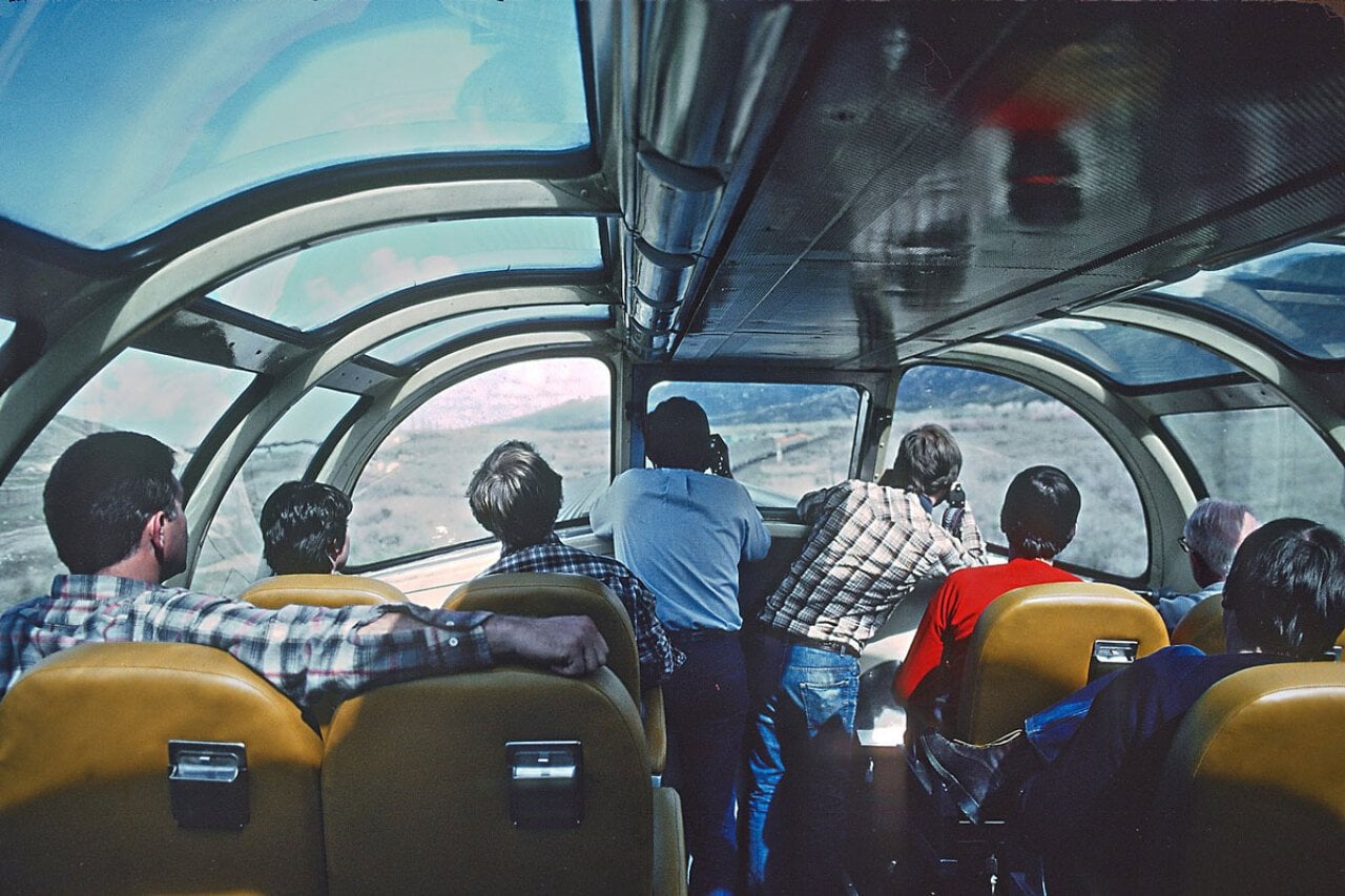 Passengers starring out the windows of the dome car of the California Zephyr
