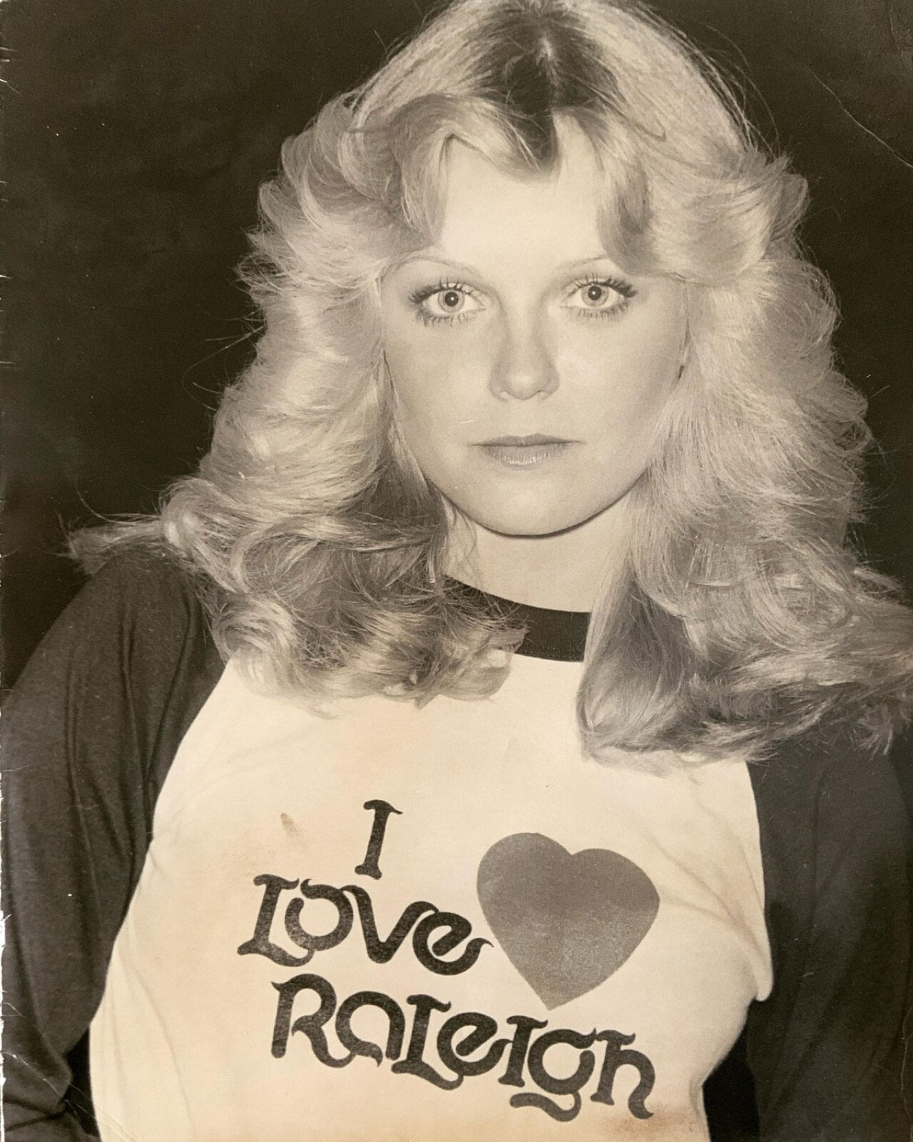 Woman with an I Love Raleigh shirt on in the 1970s