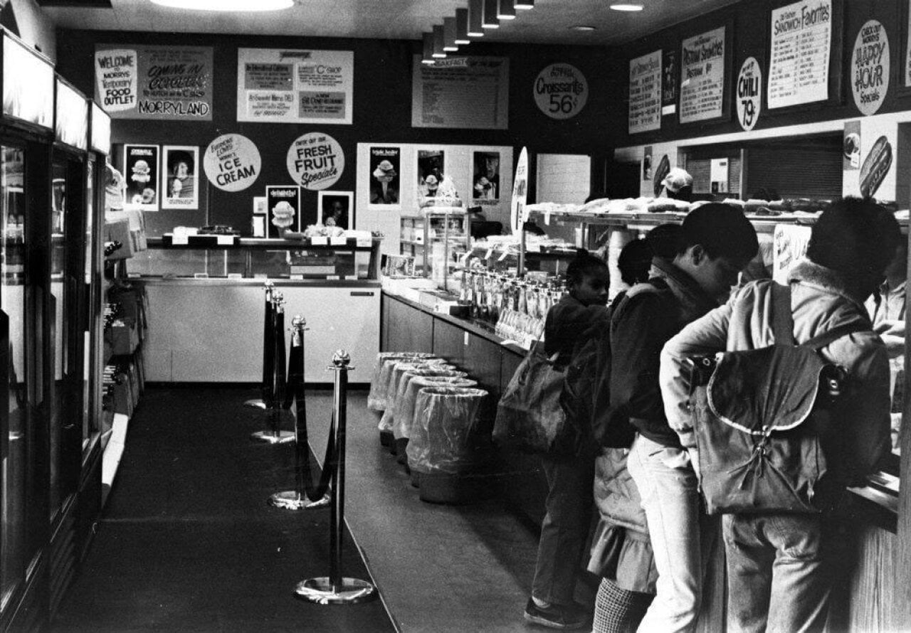 Black and white photos of kids in line at a deli in Chicago