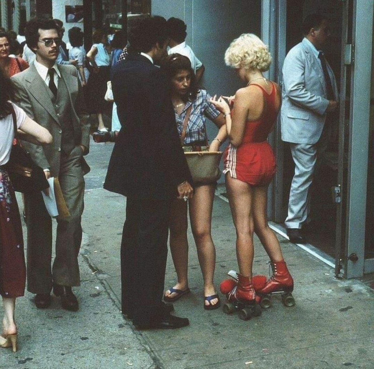 Woman wearing red roller skates on the side in NYC
