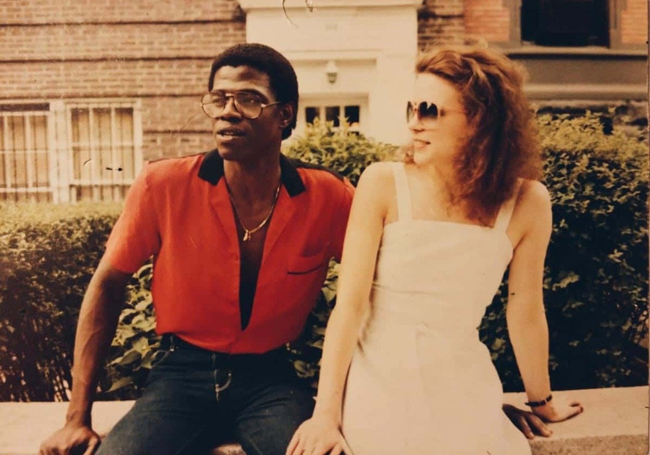 A hip couple sitting outside in Brooklyn