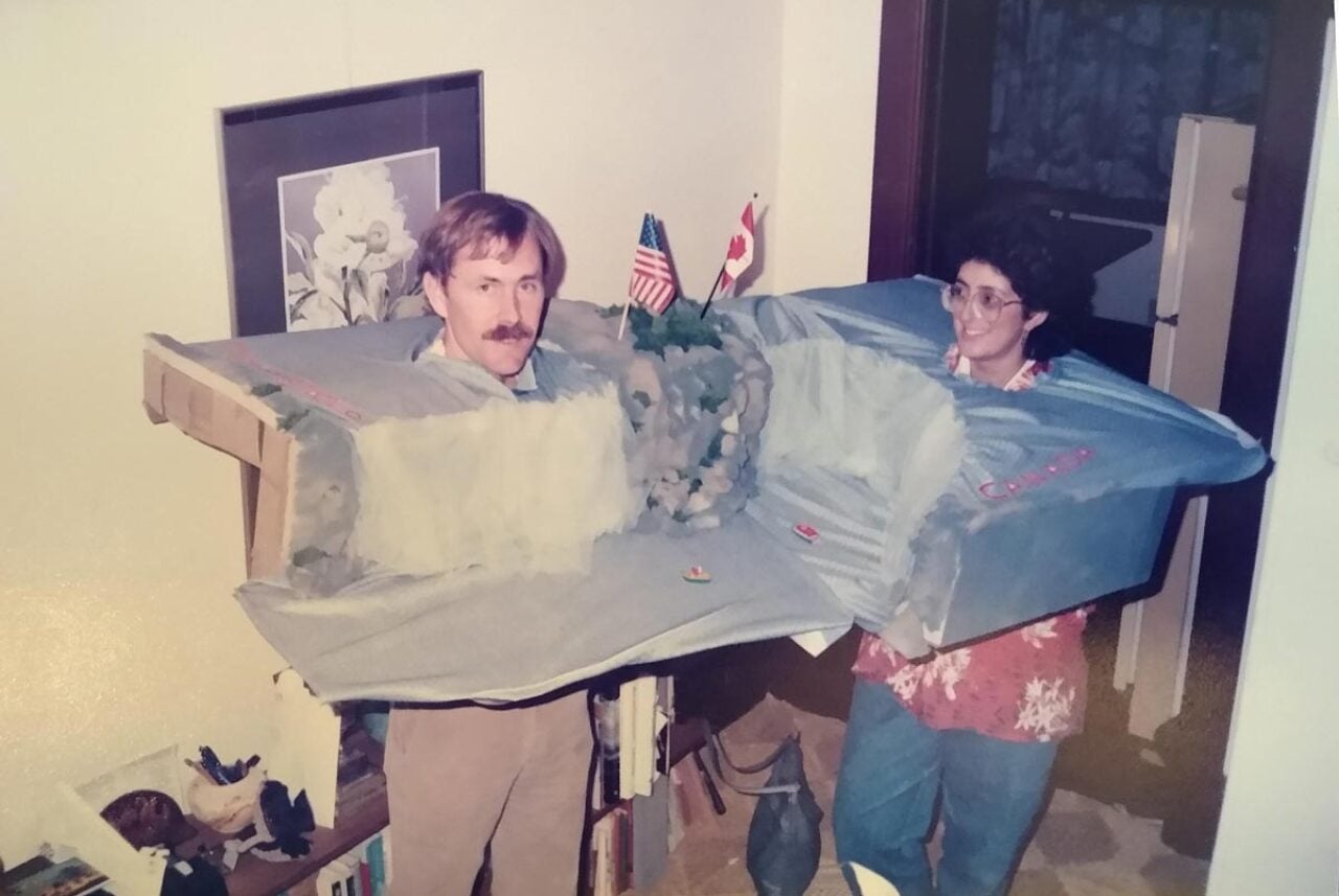 Two people in a costume of the Niagara Falls that they built