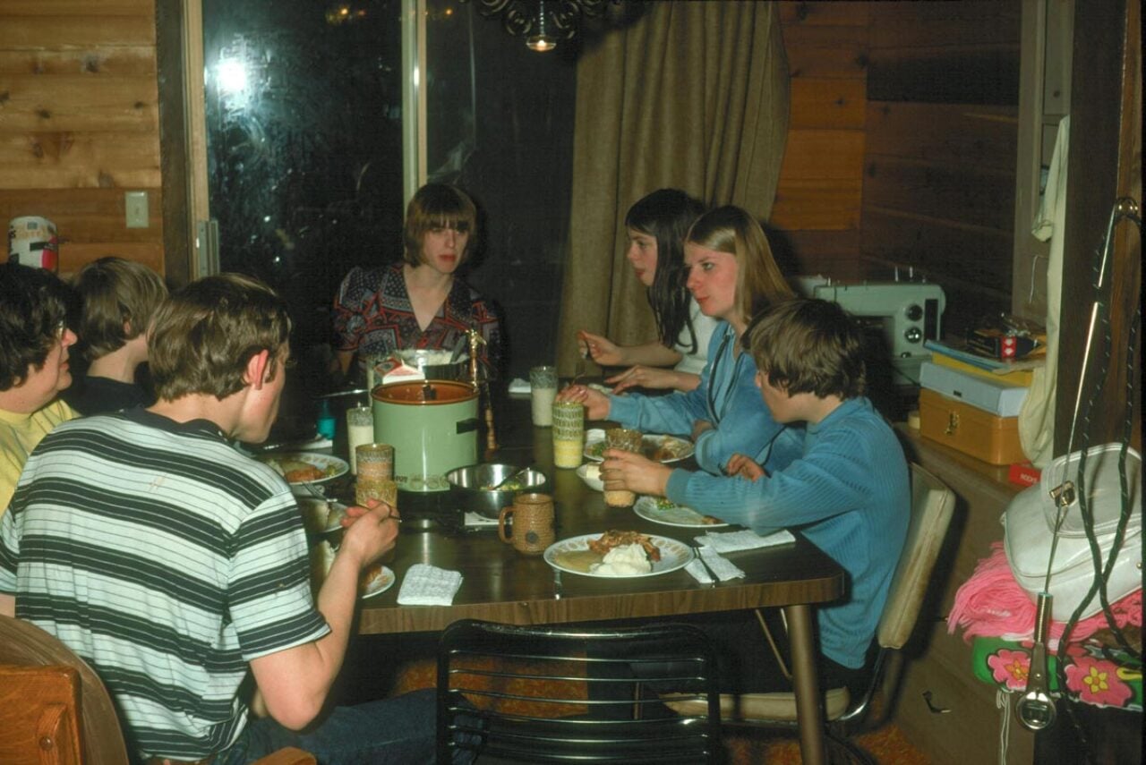 A family sitting around a dinner table eating
