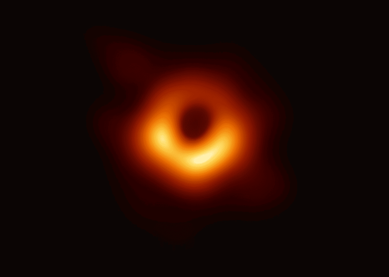 Blurry orange ring against dark background.