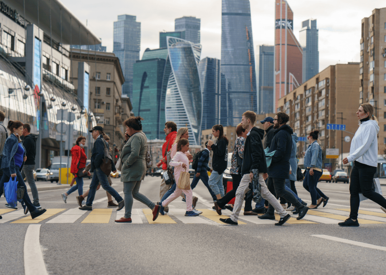 People crossing a busy street near Moscow’s business center