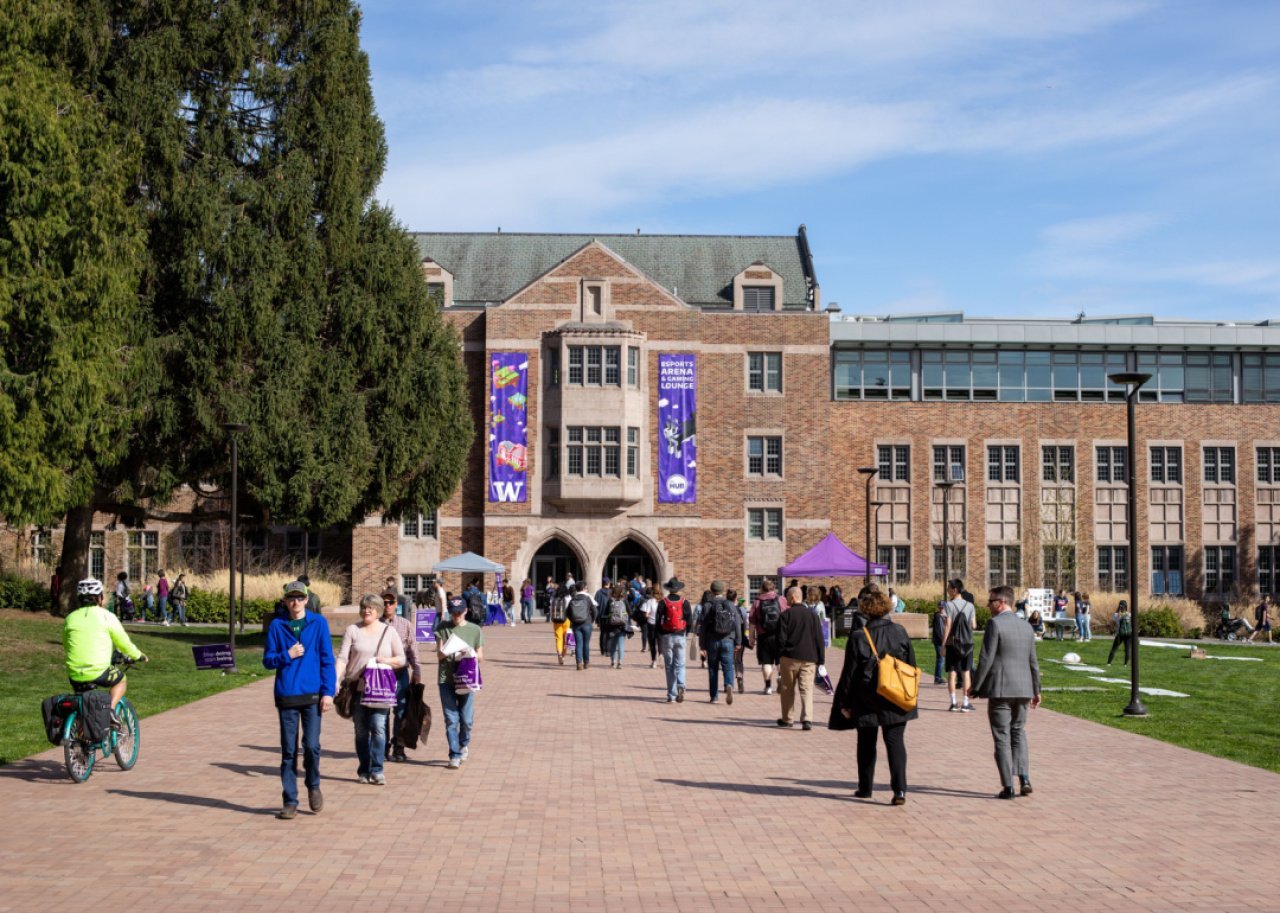 Students walking on the quad outside of The Hub Student Union Building.