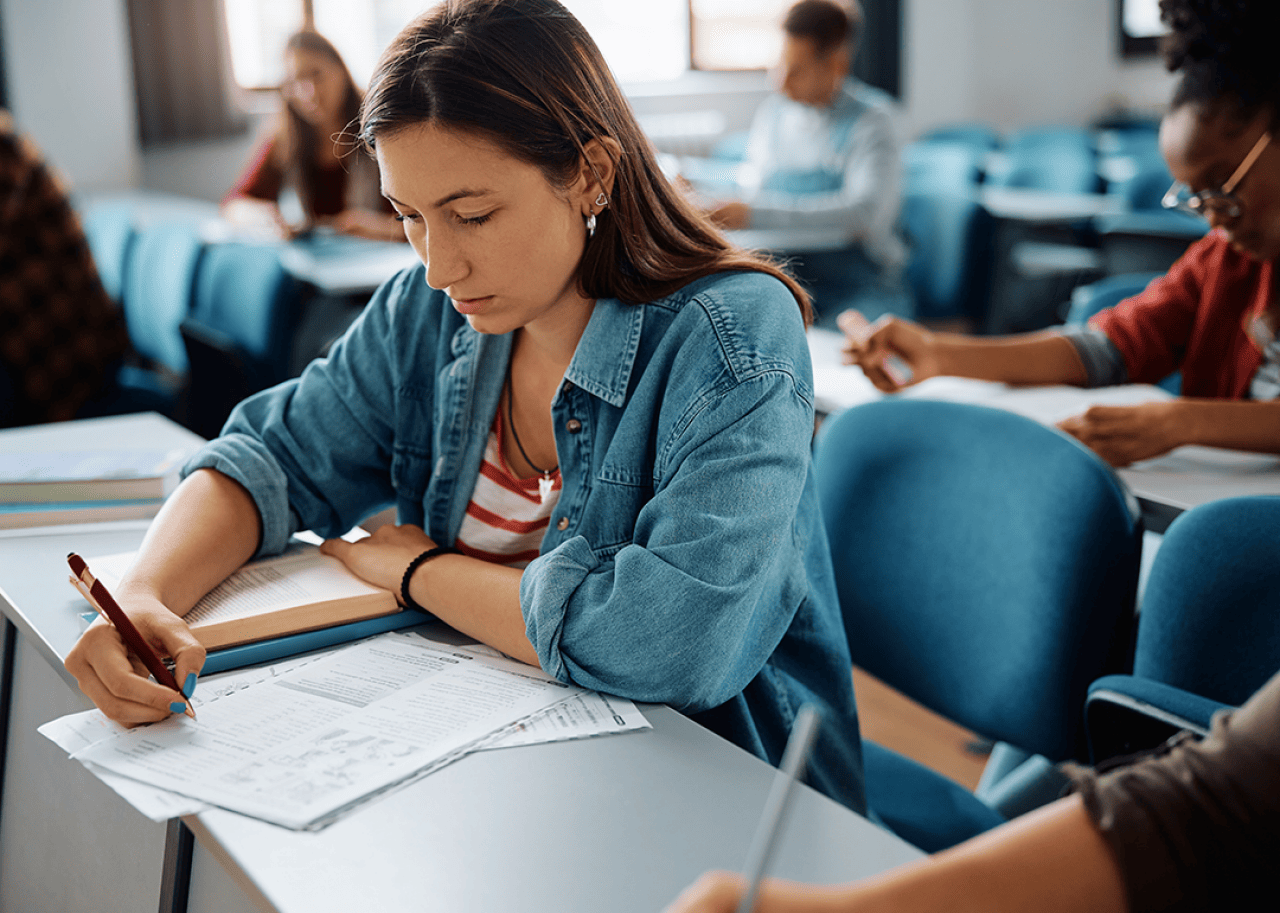 Student taking standardized test in classroom.