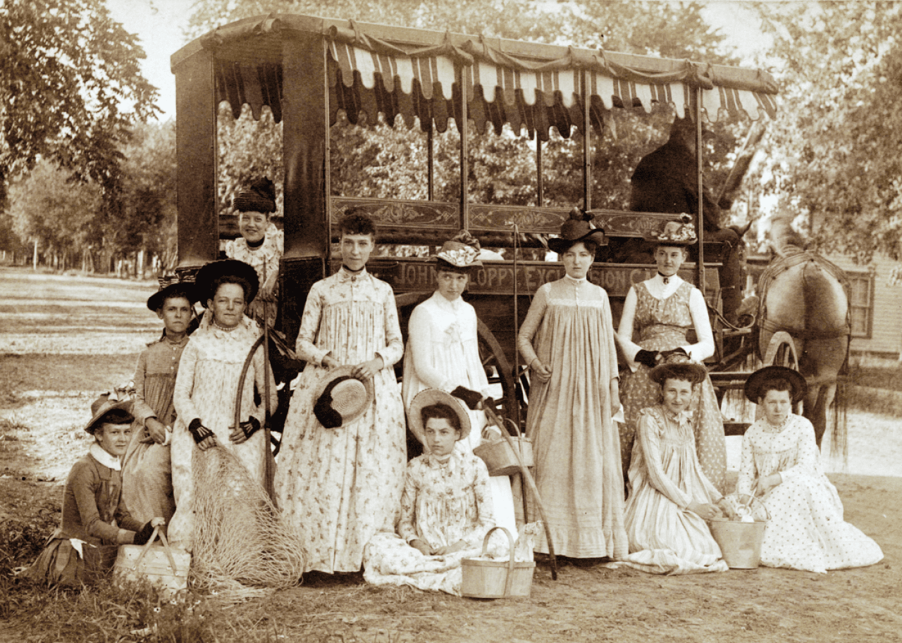 Group of young women out for a trip in a horse drawn Surrey