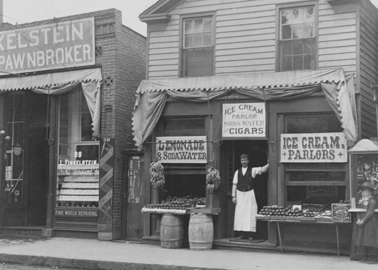 Man standing in door of ice cream parlor