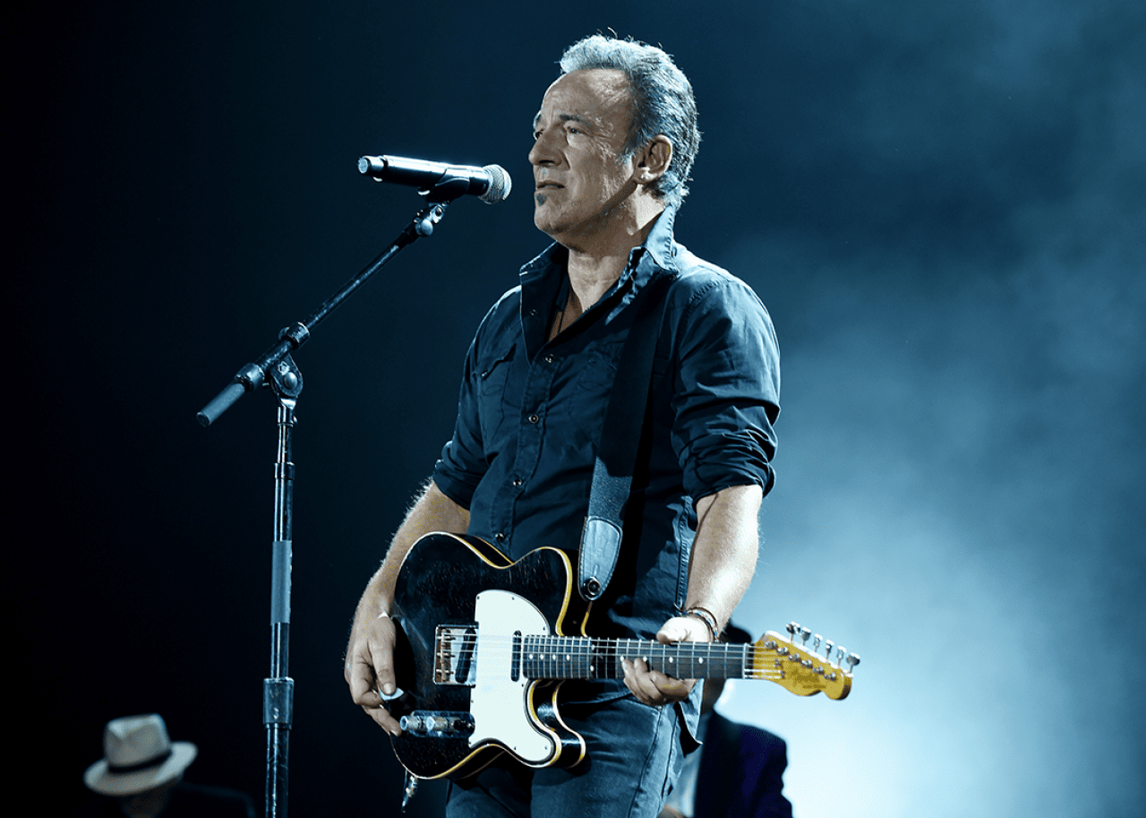 Bruce Springsteen performs onstage.
