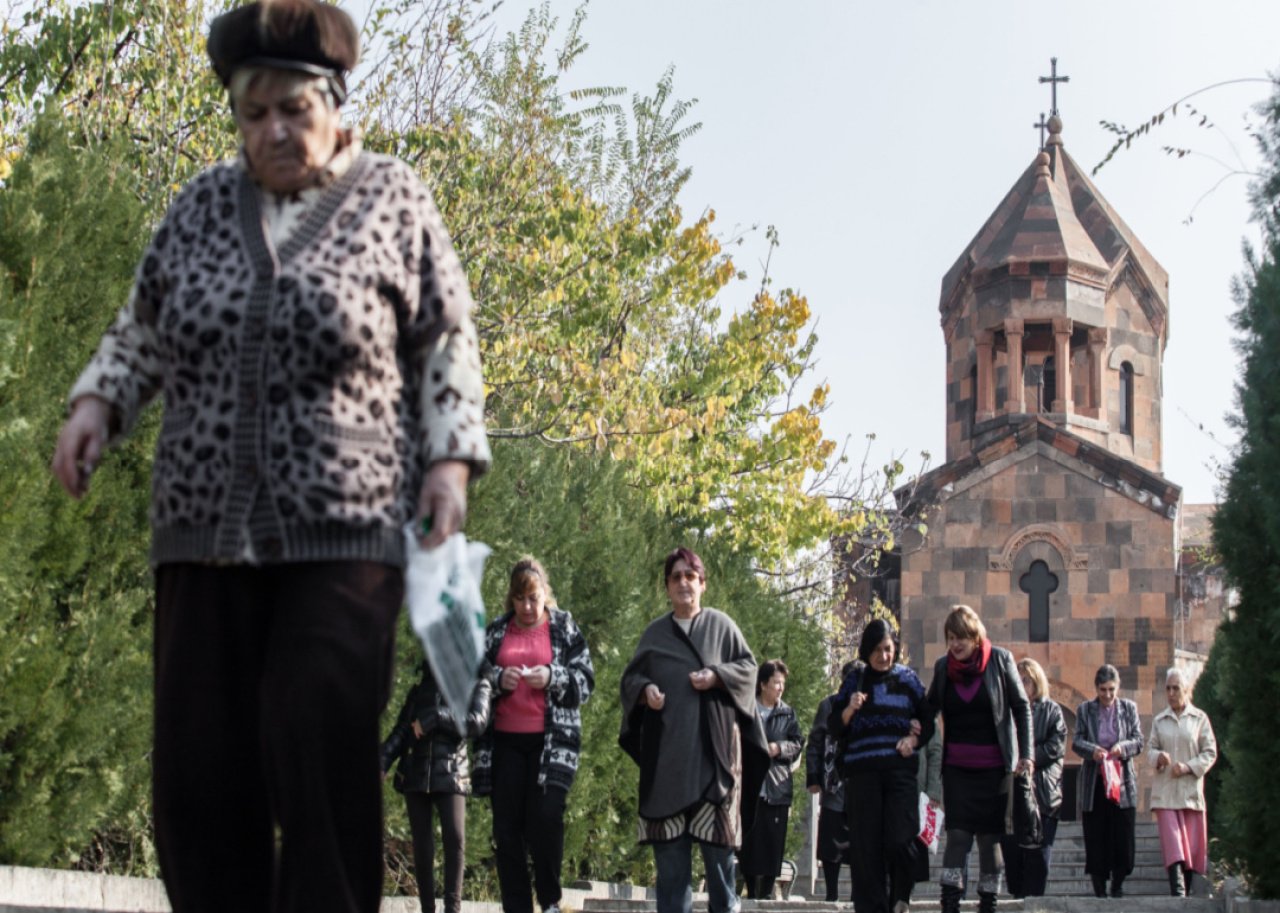 Armenian people emerge from a church in the city of Metsamore