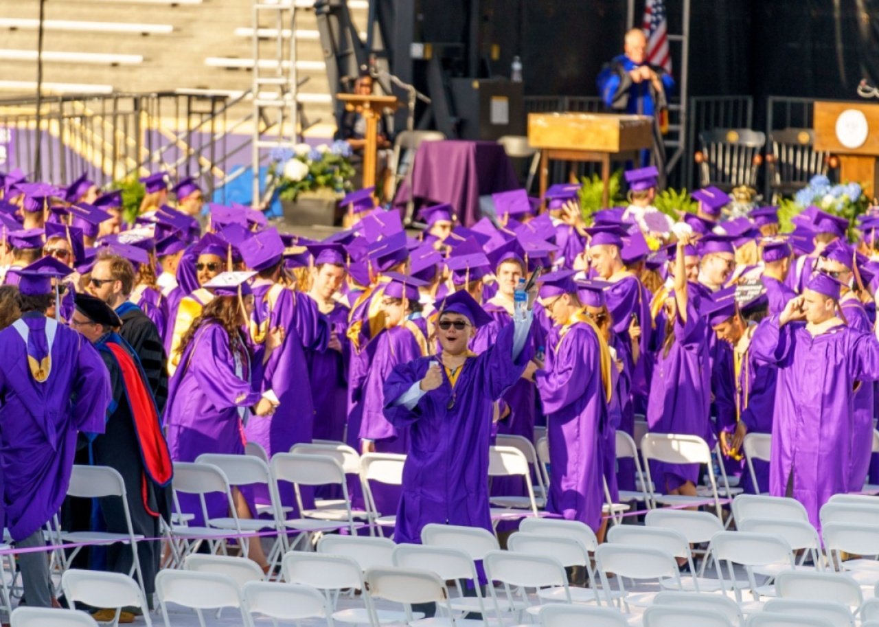 #34. James Madison University Students celebrating at graduation.