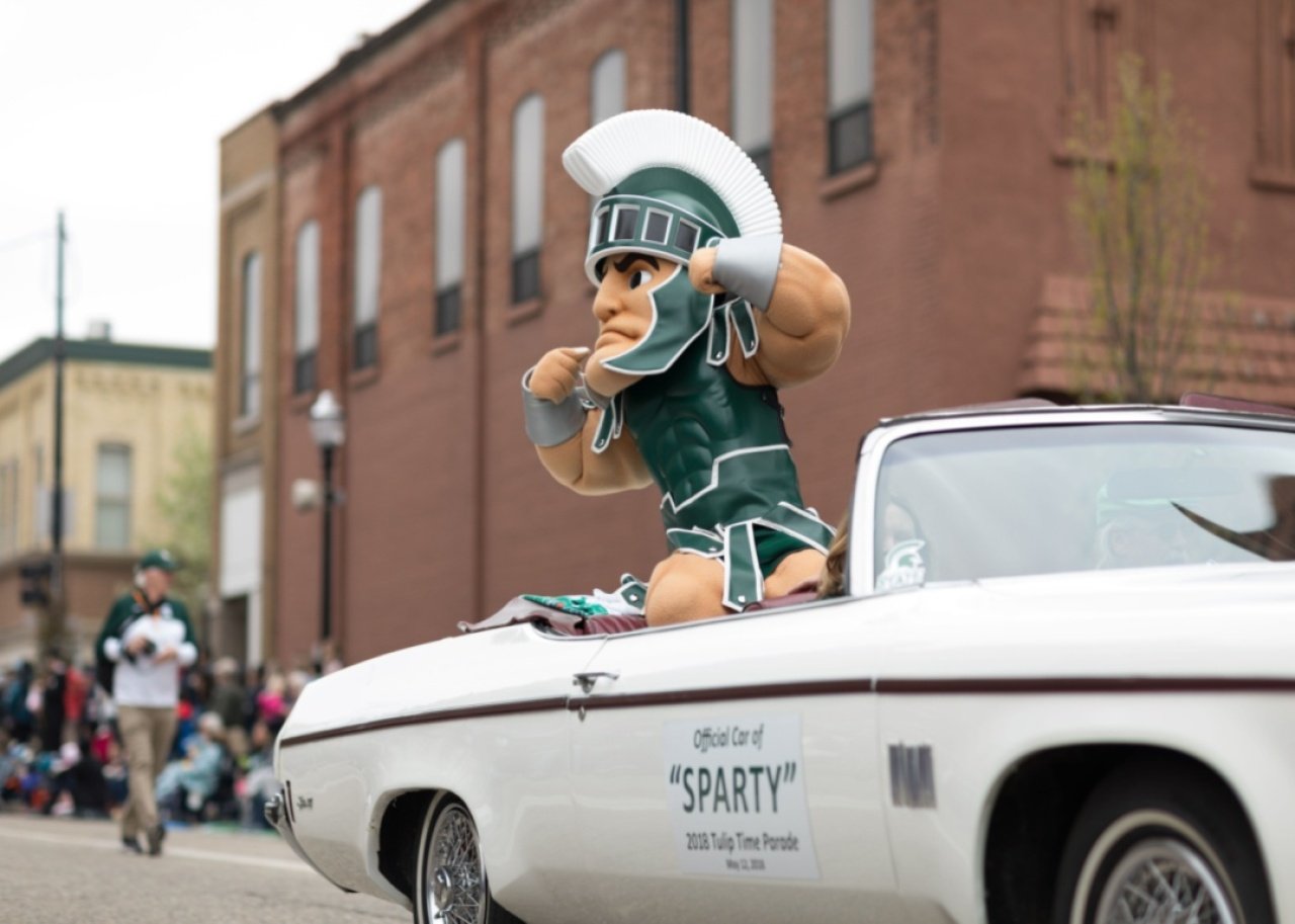 #23. Michigan State University The Michigan State University mascot riding in a parade.