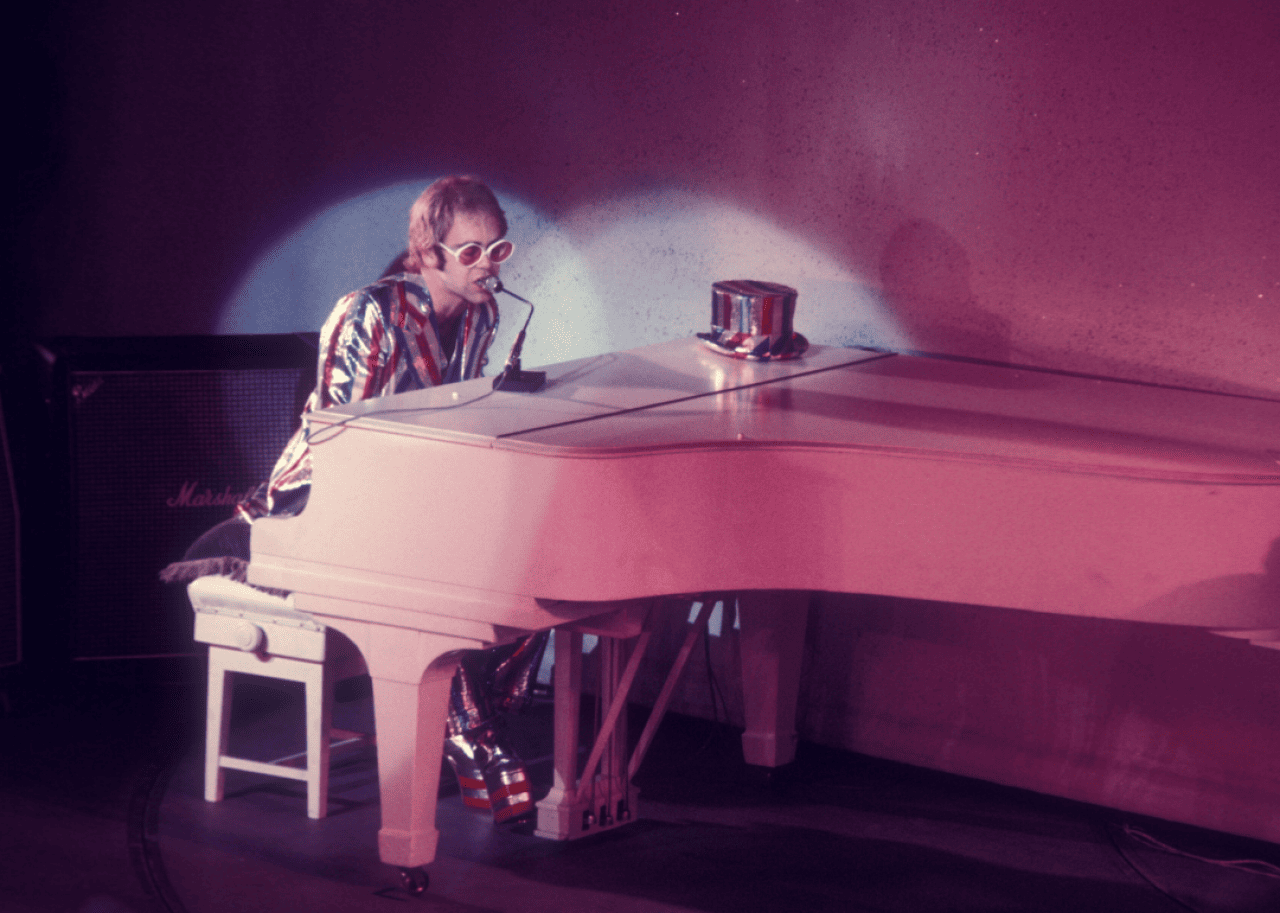 Elton John performing on stage at the 1972 Royal Variety Performance.