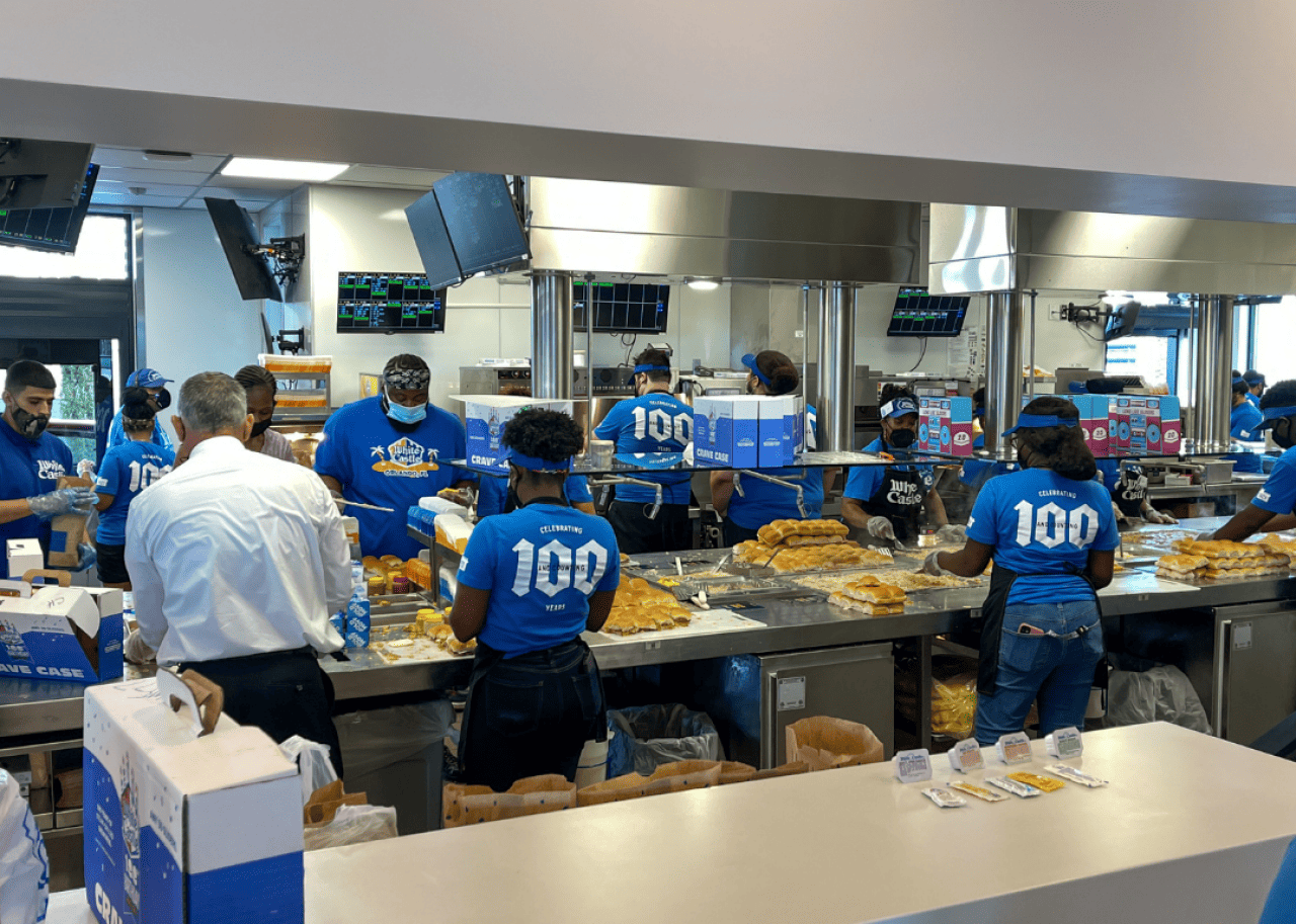 White Castle: Double Cheese Slider Employees making burgers inside a White Castle.