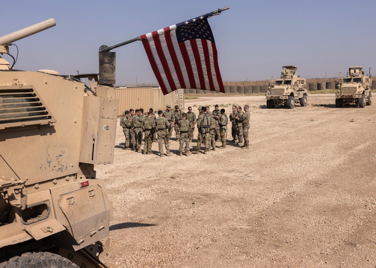 Soldiers in Syria plan for patrol.