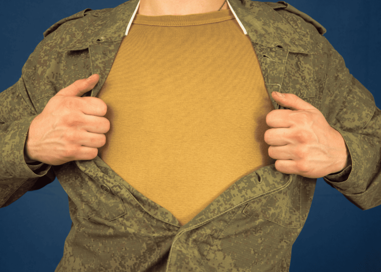 A person in camo showing the undershirt beneath their uniform.