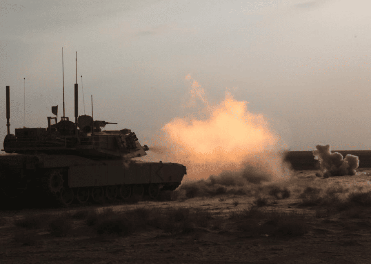 An explosion in front of a tank.